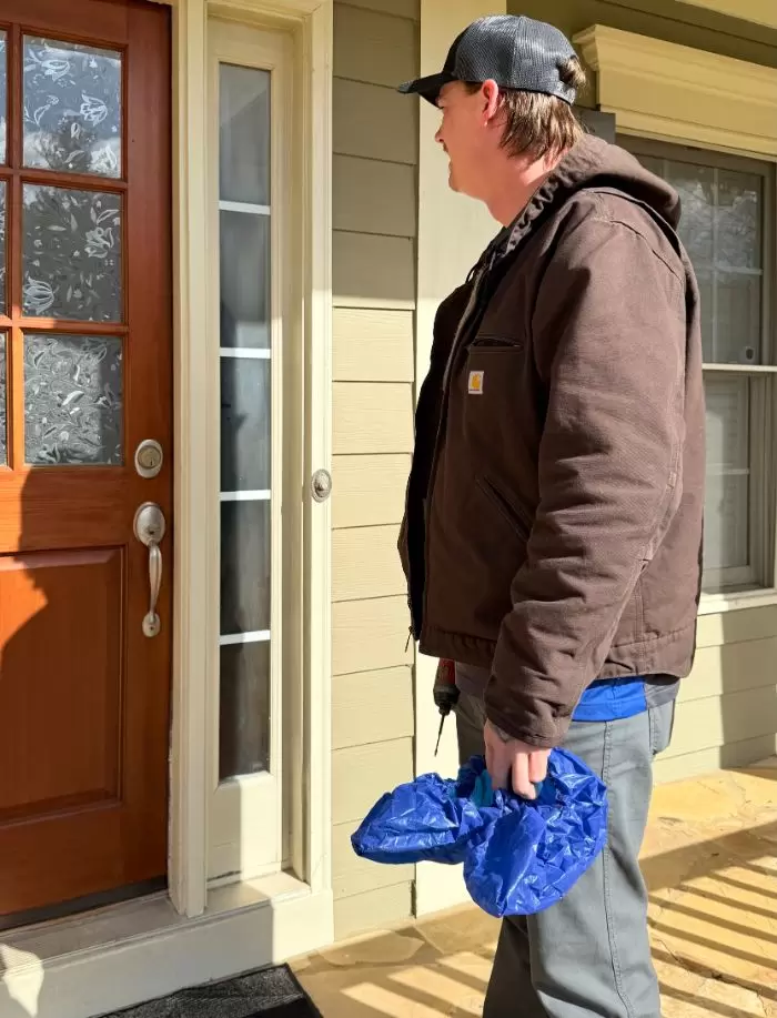 Electrician On A Clients Porch