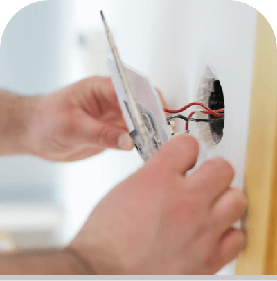 Hands Replacing Electrical Outlet