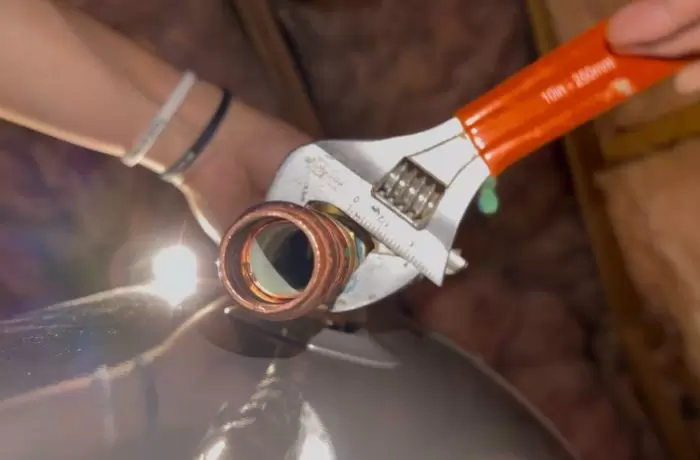 Adjustable Wrench Tightening Copper Pipe Rheem Water Heater Install 1