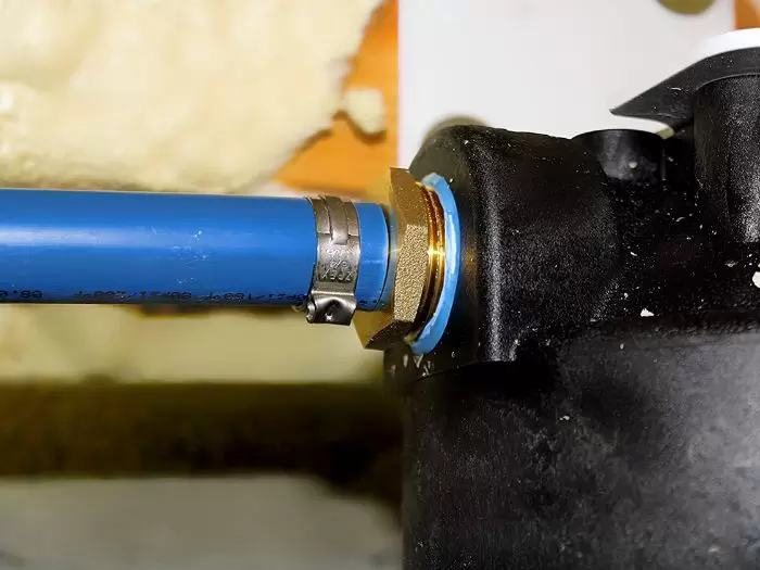 Blue Pipe Brass Fitting Clamp Connection Water Tank Closeup
