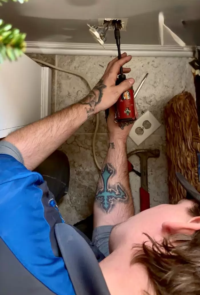 Electrician Installing Ceiling Outlet Impact Driver